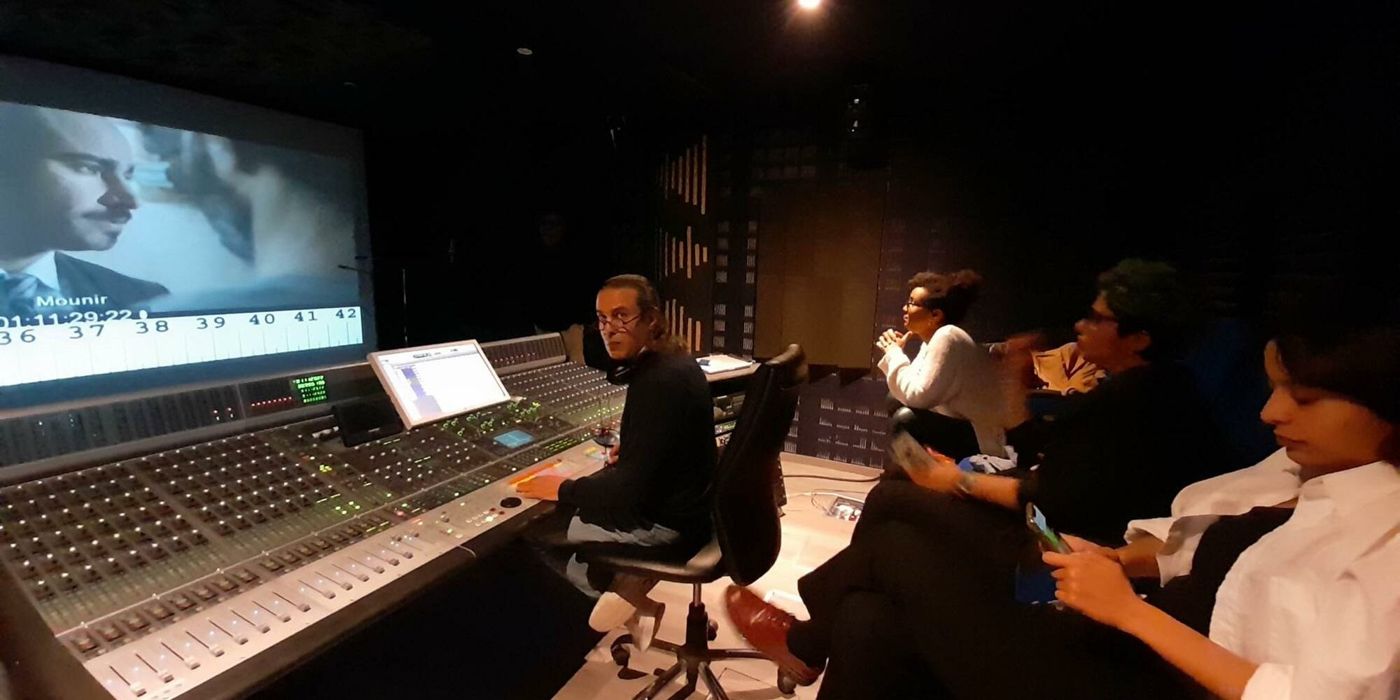 Mixing session: the team watching the picture behind the console