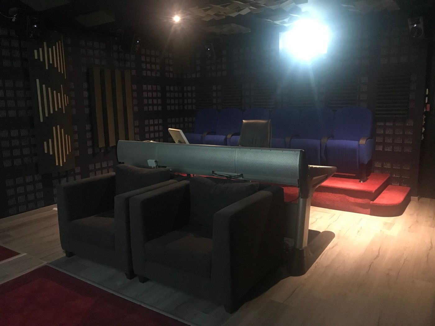 Mixing room: armchairs, console and Dolby Atmos speakers